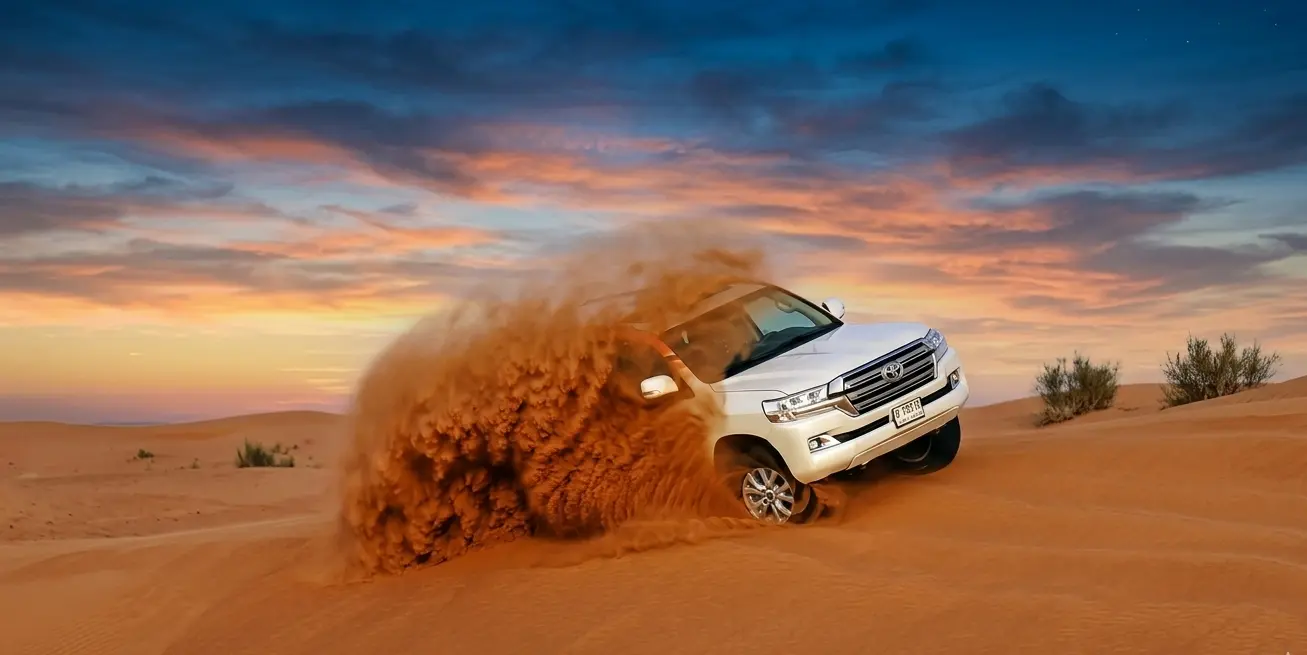 Dune Bashing in Luxury Car